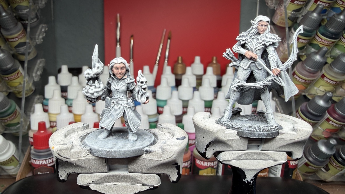 Yssala and Maena side by side at the painting bench